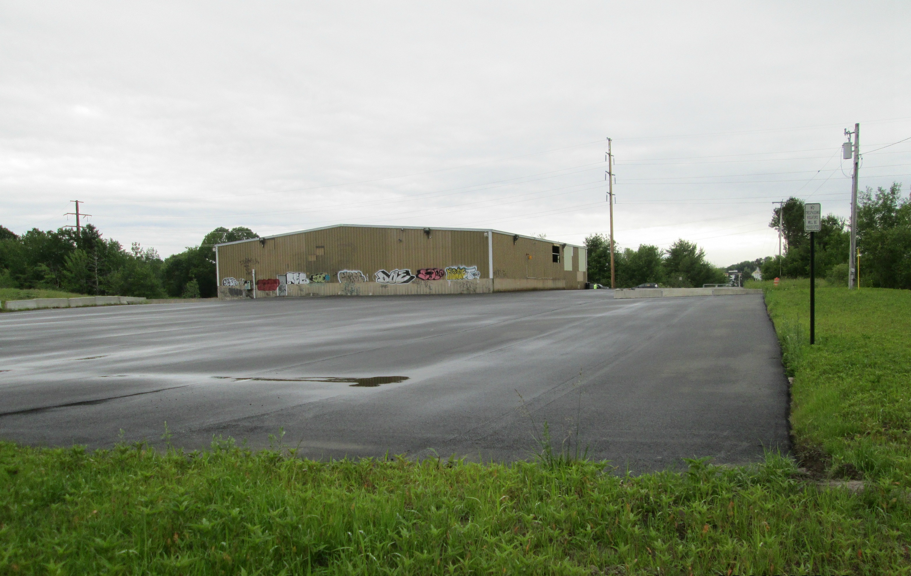 vacant industrial building and parking lot